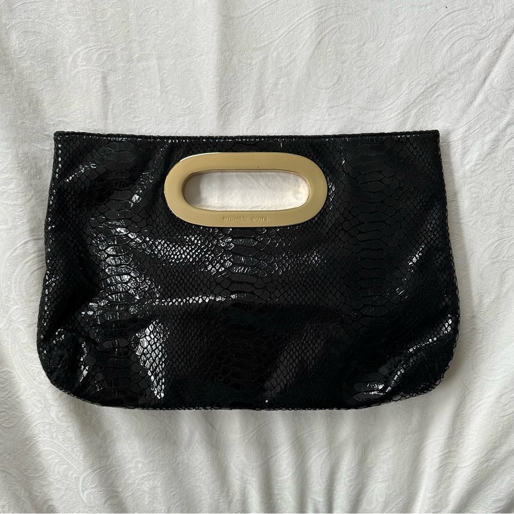 Micheal Kors animal printed clutch bag